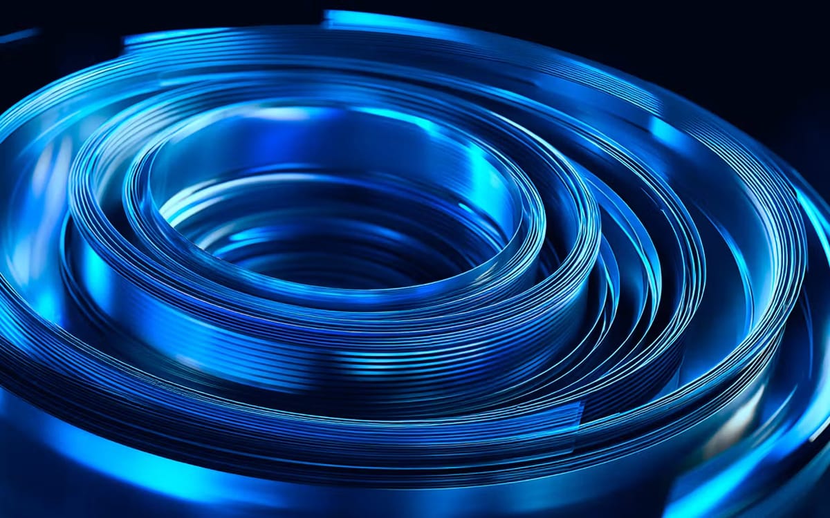 Abstract blue concentric rings from Turing’s article on the hidden costs of AI.